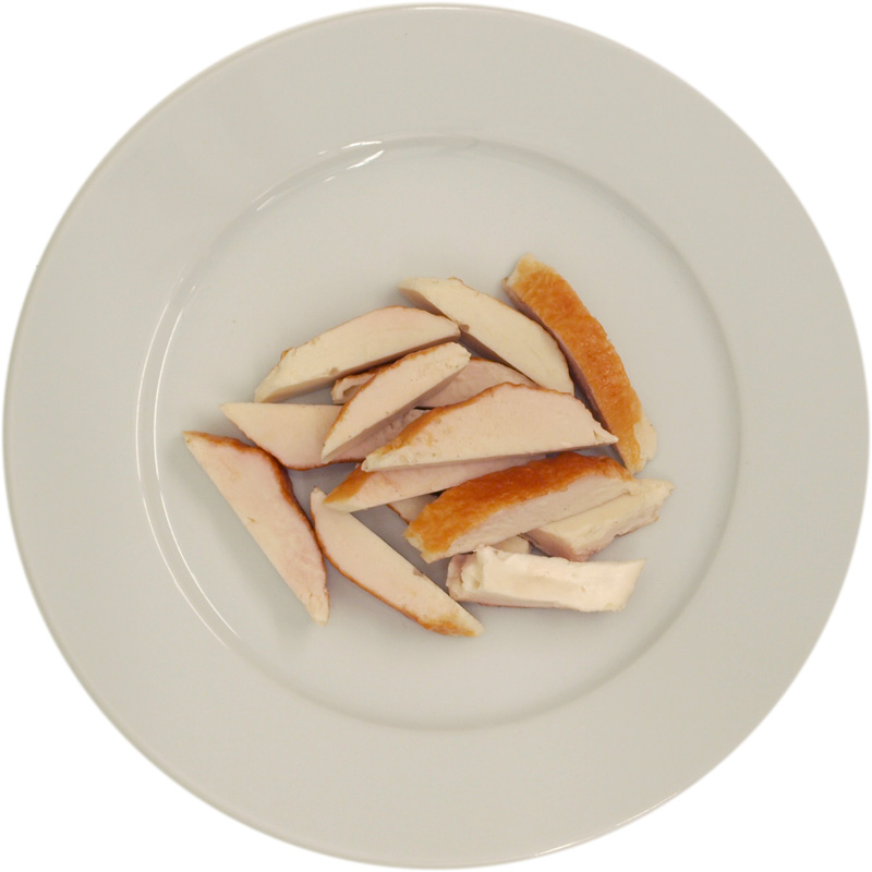 Enlarged view: A few strips of chicken breast on a dish