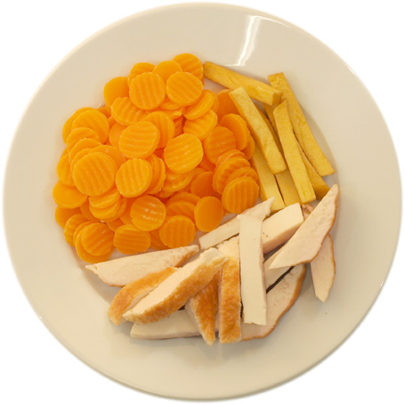Chicken with very few French fries and very many carrots