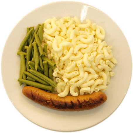 A sausage with a lot of pasta and few beans 