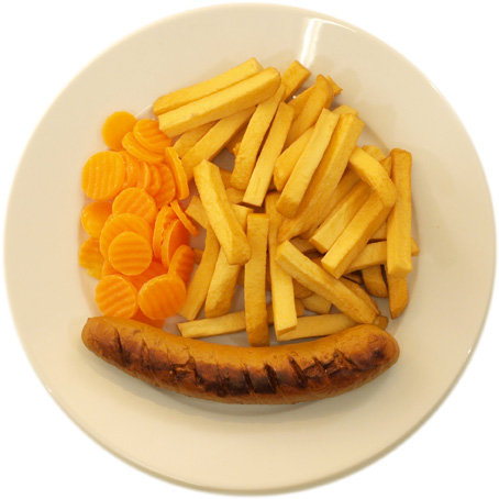 A sausage with lots of French fries and few carrots