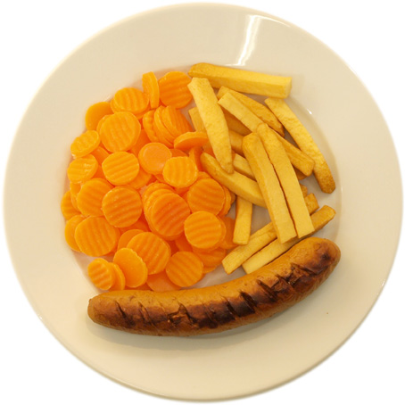 A sausage with few French fries and many carrots