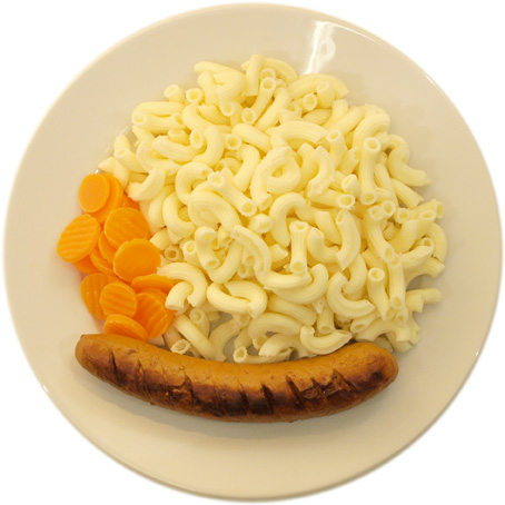 A sausage with very much pasta and very few carrots